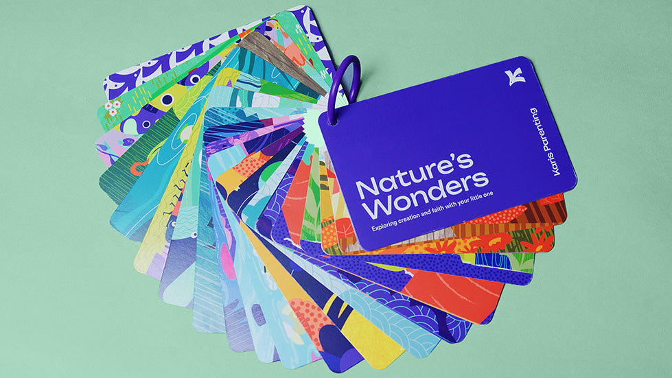 Activity card deck featuring cover card and vibrant illustrations with a binder ring
